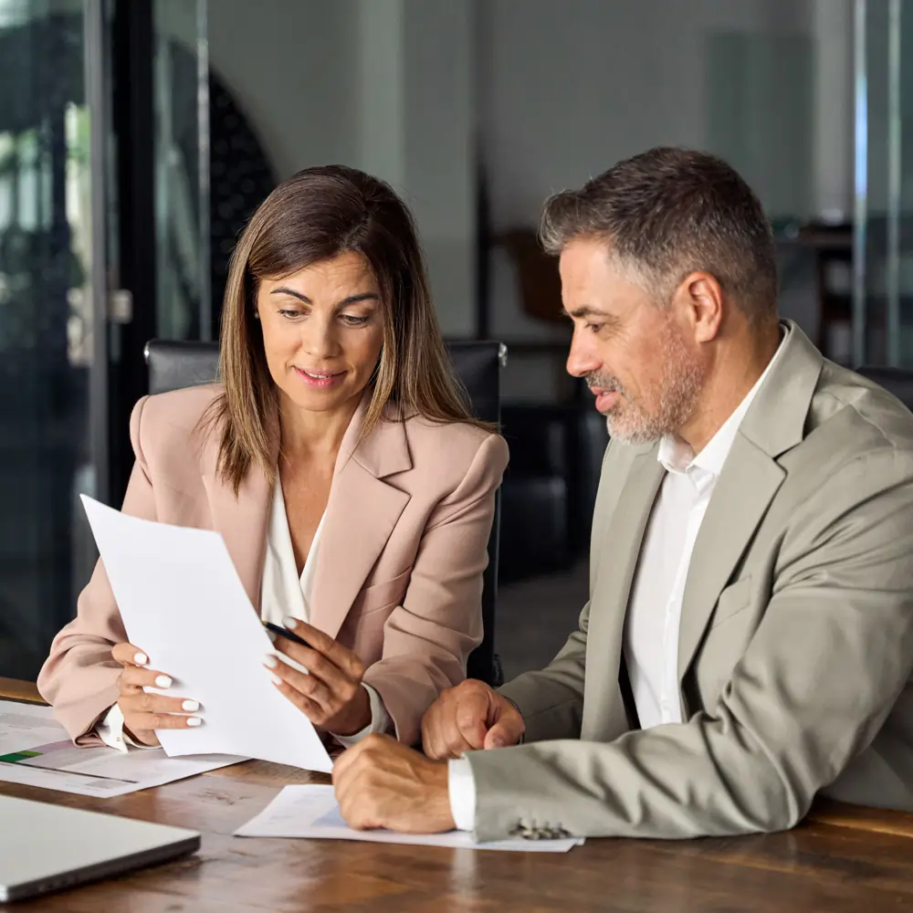 Professional consultant explaining family reunion visa assistance process to a client for international relocation.